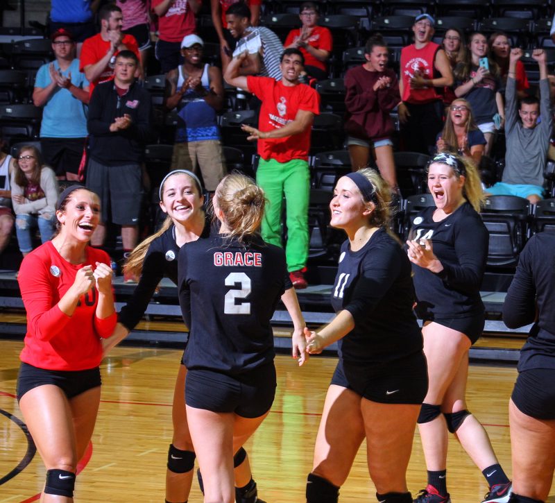 The Grace College volleyball team celebrates after beating Huntington 3-2 at home Friday night (Photo provided by Chantel Shetler)