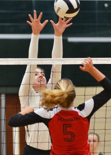 Liz Hardy goes up for a block during Thursday's contest against Plymouth. Hardy led the team in blocks for the the contest. (Photos by Nick Goralczyk)