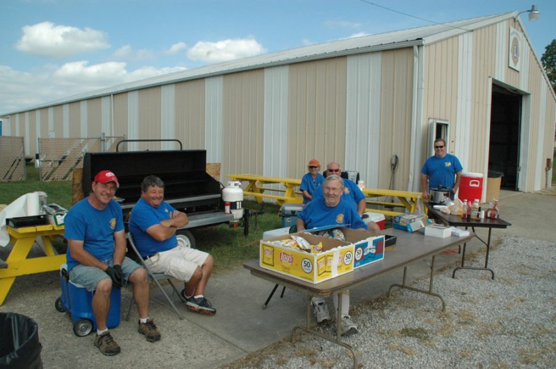 The North Webster Lions grilled hamburgers and hot dogs at the North Webster Fall Festival. From left are Derik Green, Dan Thystrup, Bob Richards, Scott Fox, Mark Lawson (in back), Greg Stump.