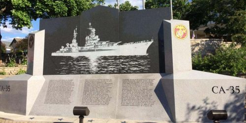 The memorial to the USS Indianapolis tells the history of the cruiser on one side and lists the names of crew members on the other. Photo by Brent Watts.