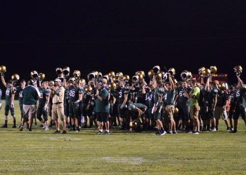 Wawasee players hold their helmets up to salute Northridge's Nick Burden as he walked off the field under his own power after suffering a seizure on the field in overtime of Friday's game. (Photos by Nick Goralczyk)
