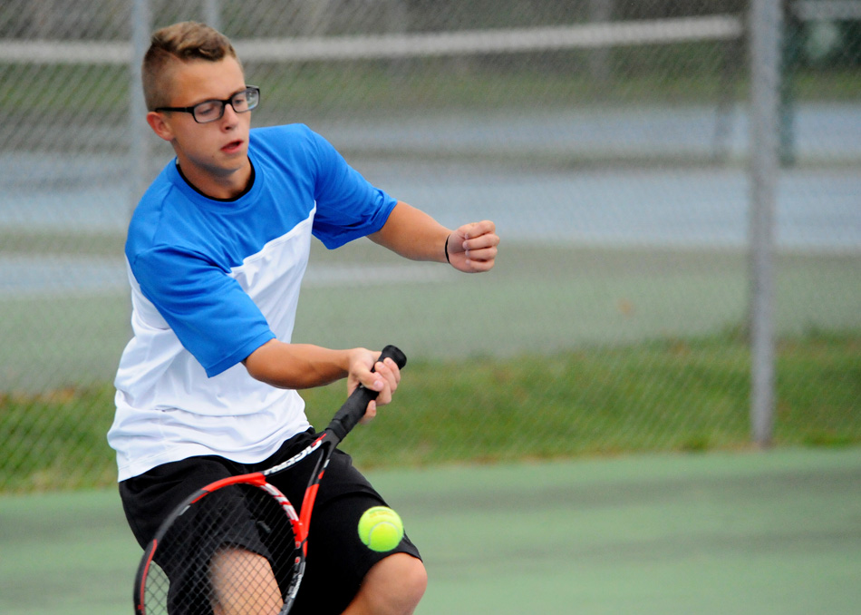 Triton No. 1 Mace Eads returns volley with Glenn's Michael Machnic at the Bremen Boys Tennis Sectional Wednesday afternoon. (Photos by Mike Deak)