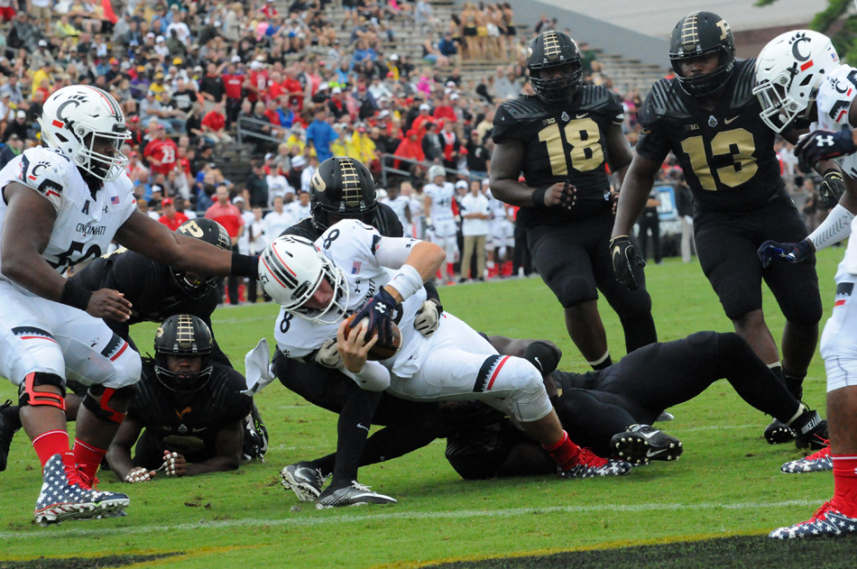 Cincinnati quarterback Hayden Moore dives into the endzone during the Bearcats' 38-20 win at Purdue Saturday afternoon. (Photo by Dave Deak)