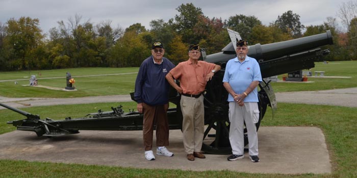 Pictured from left are Gerald Romine, RJ Hill and Bill Boardman in front of the restored canon.