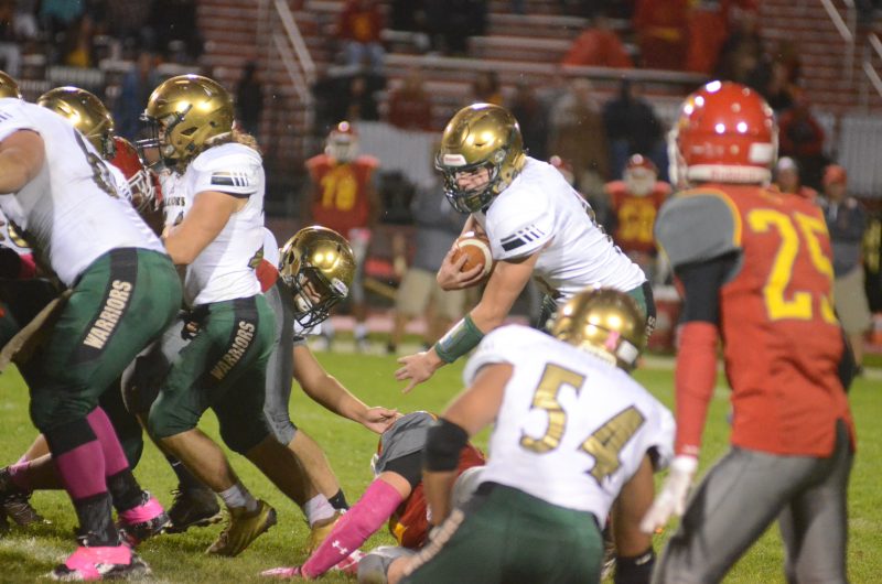 Tyler Smith looks for room to run for Wawasee Friday night. The quarterback rushed for over 200 yards and three touchdowns in a 38-14 win at Elkhart Memorial.