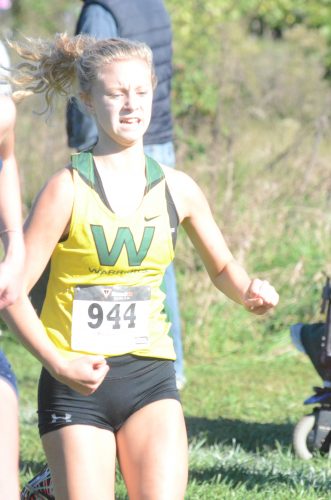 Freshman Lila Gregory heads for the finish line.