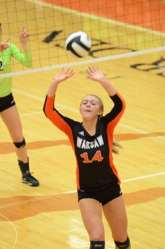 Sophomore Kacy Bragg sets the ball for host Warsaw Saturday. Bragg had an outstanding performance in a 3-1 loss to Concord in the sectional semifinals in the Tiger Den.