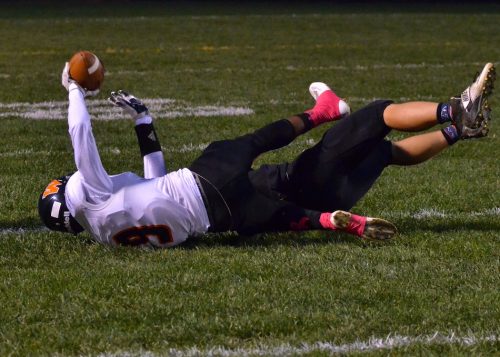 Devin Street shows the official that he made the catch during the first quarter of Friday's game. 