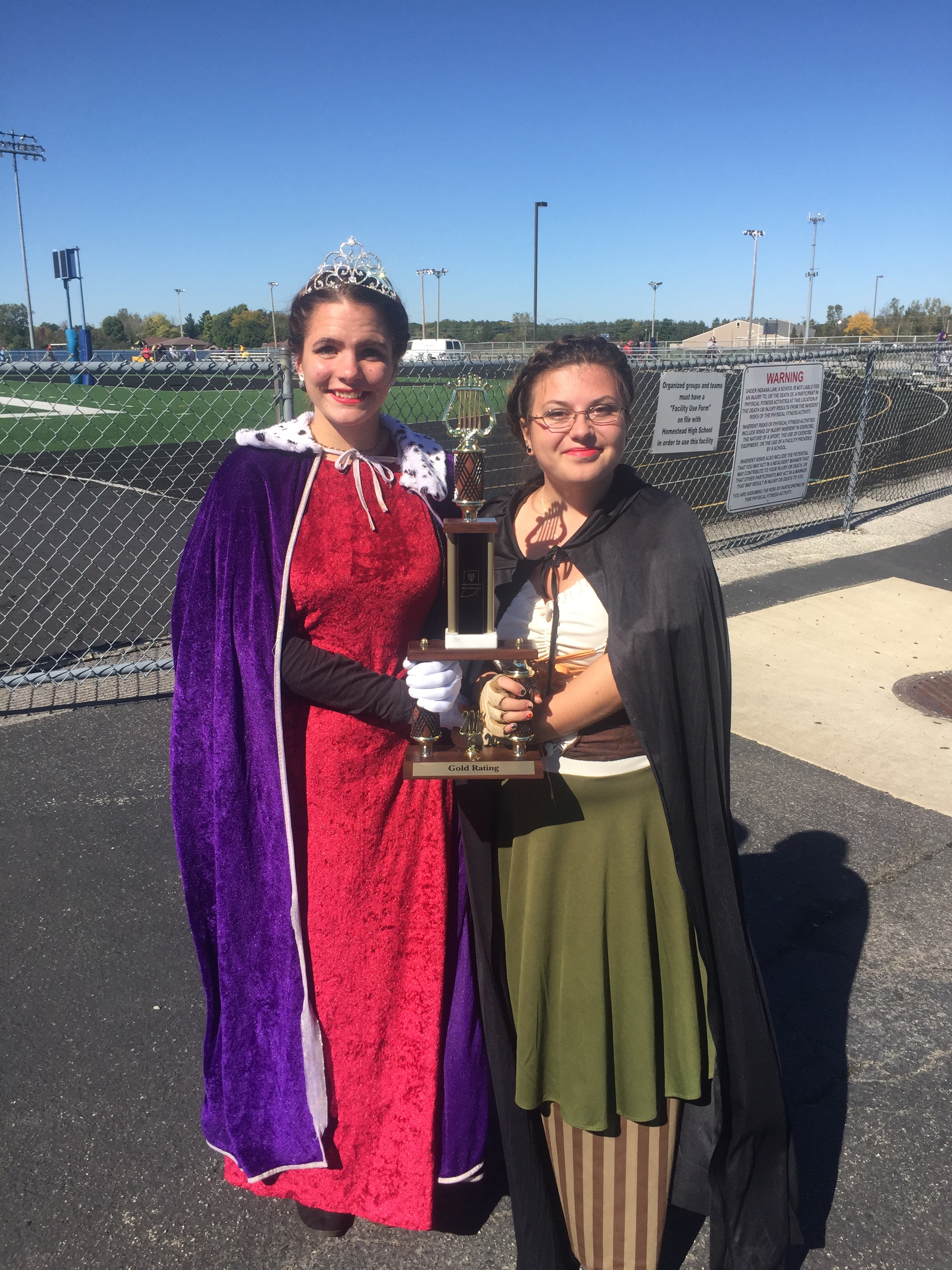 Pictured with the contest trophy are Montana Golden, drum major and Allie Ogle.