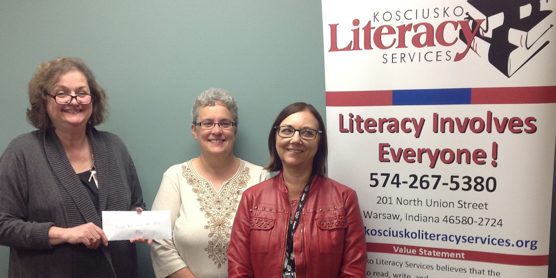 The local Johnson and Johnson Quality Systems and Services team presented Kosciusko Literacy Services Executive Director Cynthia Cates with a monetary donation and a donation of 175 gently used books.  The children’s books will be placed in bins in waiting rooms and common areas of housing units.  Books for adults will be circulated in the adult basic education classes.  From left to right are Cates and Keli McLeod and Amy Stephenson from the local Johnson and Johnson Quality Systems and Services team.