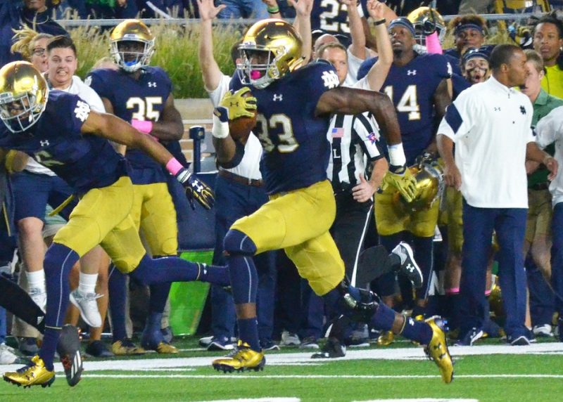 Josh Adams breaks away for a game-tying touchdown later in the contest against Miami.