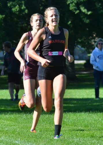 Warsaw's Remi Beckham edges out CMA's Mary Terhune in the home stretch of Saturday's sectional race. (Photos by Nick Goralczyk)