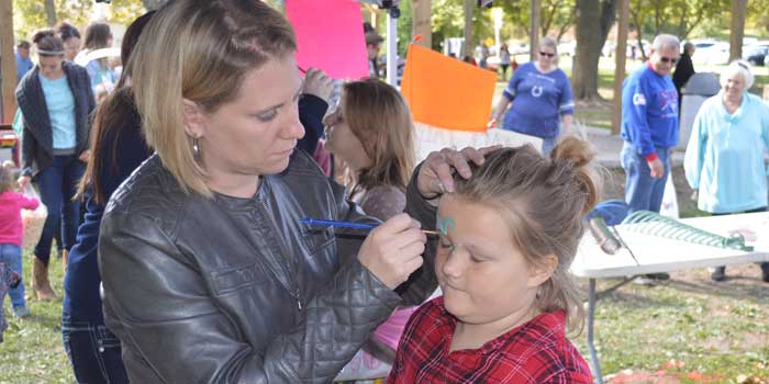 Syracuse Fall Harvest Festival will have several, fun activities for the entire family to enjoy. Face painting and games are part of the day’s activities. Pictured is Rachel Kruger of Kruger Doodles painting the face of Rori Methe, 5, of Syracuse at last year’s festival. (File photo)