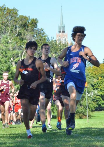 Warsaw's Zeb Hernandez (left) and Caston's Mitchell Rans (right) pace the pack early on during Saturday's race. Rans won the sectional while Hernandez was second. (Photos by Nick Goralczyk)