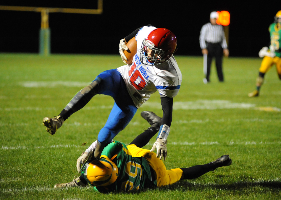 West Noble's Jason Pruitt is taken down by Tippecanoe Valley's Jalen Potter during the Chargers 30-28 win over the Vikings Friday night in the Class 3-A sectional. (Photos by Mike Deak)