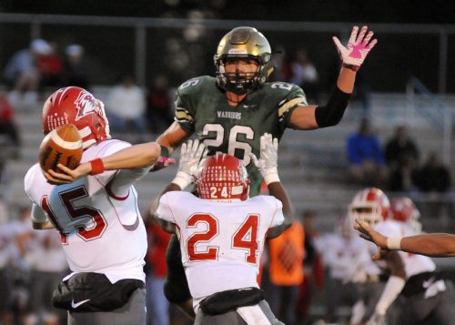 Wawasee's Paul Mendoza attempts to knock down a CJ Detweiler pass.