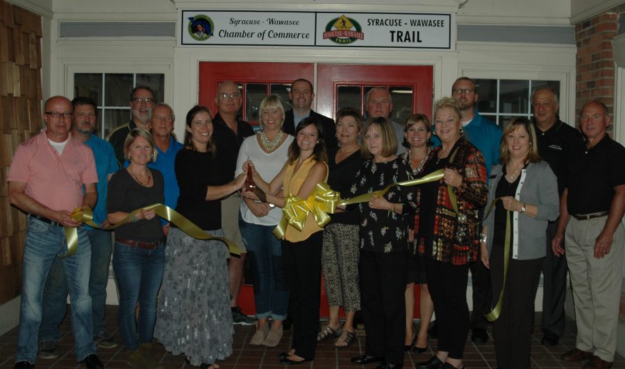 Pictured in front, from left, are Steve Fields, chamber member; Kristy Rumfelt, chamber board member and Beyond Landscaping; Megan McClellan, director of Syracuse-Wawasee Trails; Andrea Keller, executive director of Syracuse-Wawasee Chamber of Commerce; Julie Kline, executive assistant to the Syracuse-Wawasee Chamber of Commerce; Sylvia Gargett, chamber member; Jill Donley, Bass Audiology. In the second row are Chad Jonsson, superintendent of parks and recreation department; Dave Mayer, chamber member; Tricia Small, Teghtmeyer Ace Hardware; Judy Shoemaker, WACF and chamber member; Dawn-Marie Bass, Bass Audiology; Denny Pressler, Stoney Point LLC. In back are Tom Edington, Syracuse-Wawasee Trails Committee; Chip Erwin, chamber board member and Sleepy Owl; Heath Simcoe, chamber board member and Mutual Bank; Jim Layne, chamber board member and police department; Erick Leffler, Dynamic Spine and Rehabilitation; and Henry DeJulia, town manager.