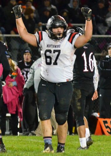 Andrew Miller pumps up the crowd after the Panther defense makes a stop during Friday's 21-14 semi-state victory over Lowell. (Photos by Nick Goralczyk)