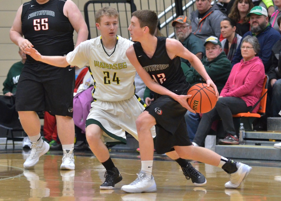 Cameron Schlabach (24) will be one of three seniors looking to lead Wawasee to a winning record in 2016-17. (File photo by Nick Goralczyk)