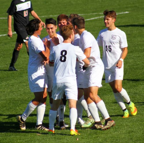 Grace's men soccer players celebrate Damon Binkley's goal in the first half of a 7-0 win over Lancaster Bible Saturday afternoon. (Photo provided by the Grace College Sports Information Department)