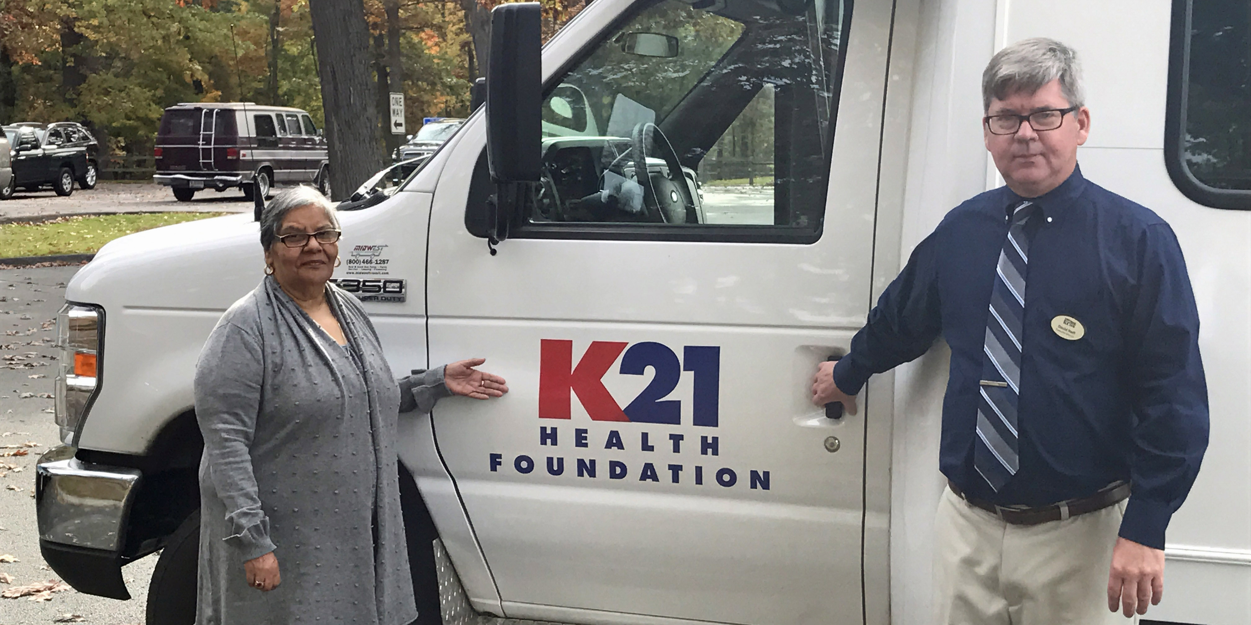 Ysabel Lozano and David Neff, KCSS Executive Director, pictured next to the new transportation van.