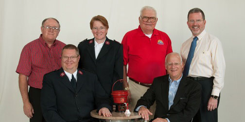 Seated, from left, are Major Bill Welch, Corps Officer; Jim Griest, Warsaw Rotary Club. Standing are Jim Reeve, Lions Clubs; Major Trish Welch, Corps Officer; Merle Heckaman, Warsaw Breakfast Optimist Club and Mike Suhany, Warsaw Kiwanis Club. Not pictured was Roger Laird, Kosciusko County Shrine. 