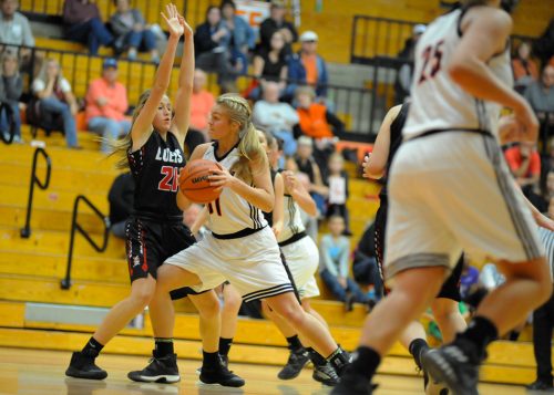 Warsaw's Kacy Bragg muscles to the hoop against Luers' Lydia Reimbold.