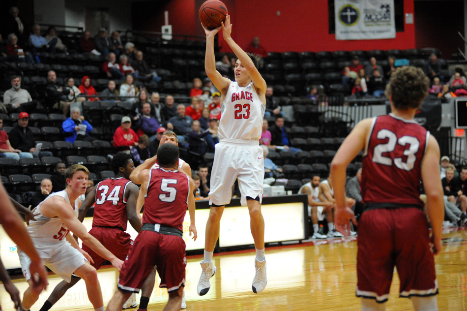 Grace College's Charlie Warner attempts a long jumper against Rochester College Saturday evening.