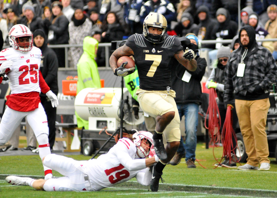 Purdue's DeAngelo Yancey hustles down the sidelines to score a touchdown in Purdue's 45-17 loss to Wisconsin Saturday afternoon at Ross-Ade Stadium. (Photos by Dave Deak)