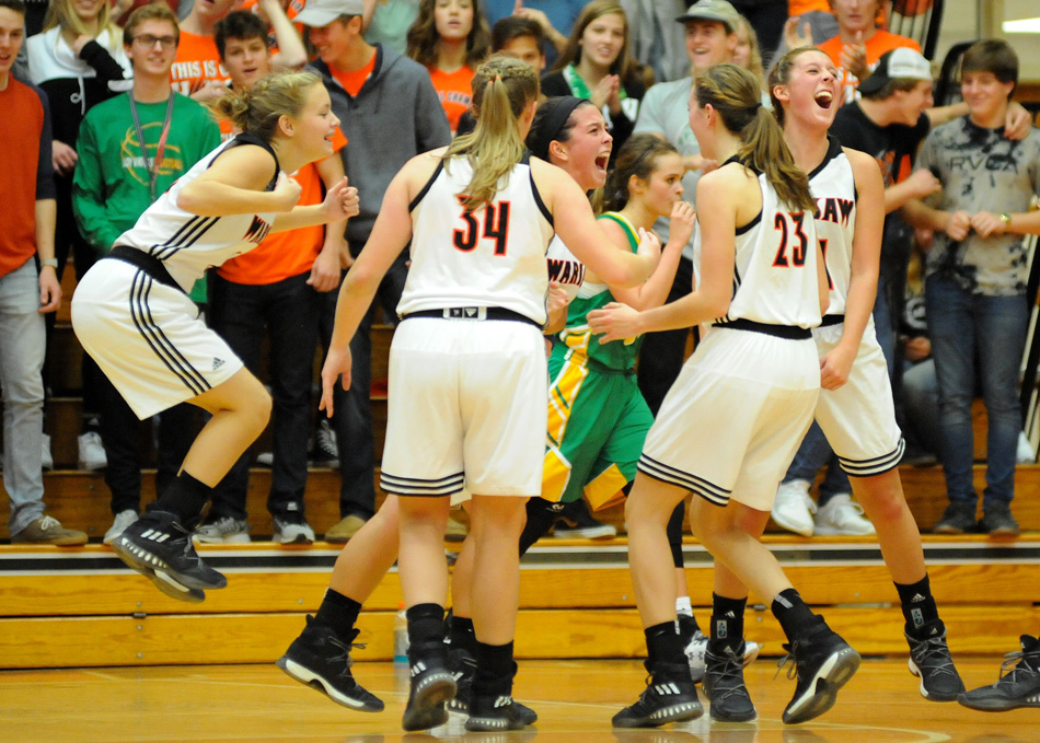 Page Desenberg, center, celebrates with her teammates after hitting a buzzer-beater during a 66-42 win over Tippecanoe Valley in girls basketball Friday night. (Photos by Mike Deak)