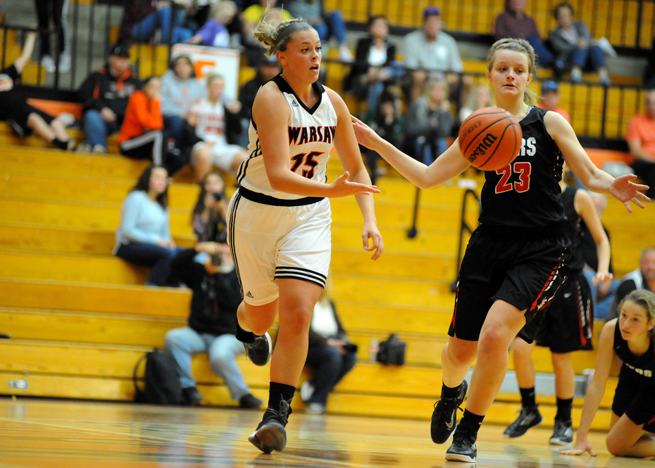 Warsaw's Madi Graham saves a ball back inbounds against Fort Wayne Bishop Luers.