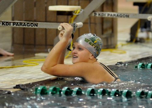 Wawasee's Kaia Manning reacts after setting a lifetime best in the 100 free against Warsaw.