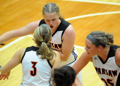 Kaylee Patton, facing, celebrates with sister and teammate Kennedy Patton (3) along with Madi Graham (25).