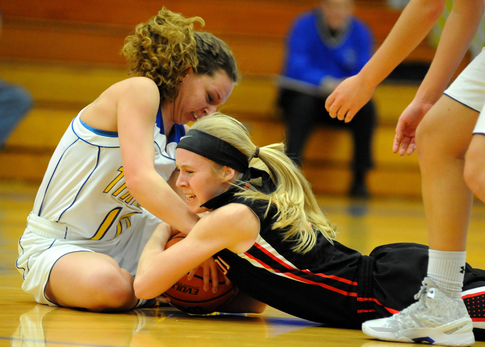 Triton's Quinn Downing and NorthWood's Riley Hershberger lay claim to a loose ball Tuesday night.