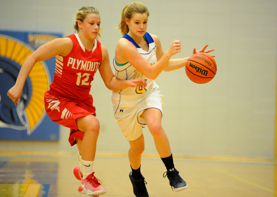 Triton's Sara Stevens advances upcourt against Plymouth's Kacee Peters Thursday night.