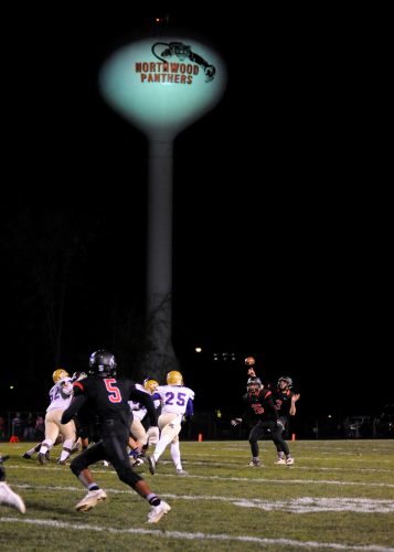 NorthWood quarterback Trey Bilinski sends a pass to DeAndre Smart in the first half of the regional football game against New Haven Friday night at Andrews Field. (Photos by Mike Deak)