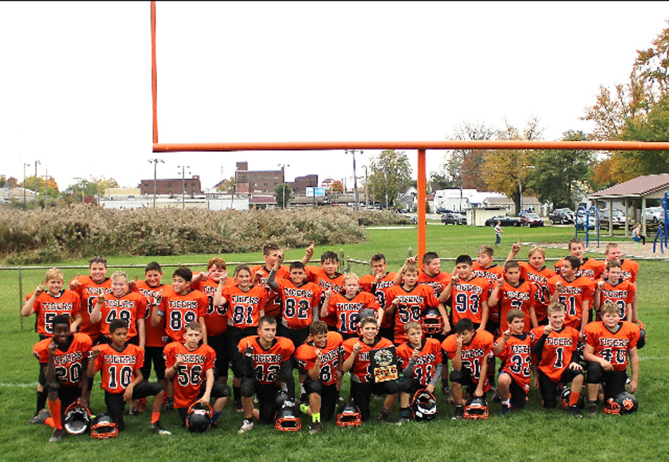 The Young Tigers football team celebrated an undefeated season following a win at the Tiger Invitational this past weekend. (Photo provided)