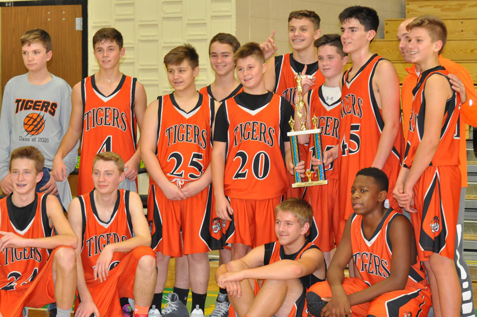 The Edgewood eighth grade boys basketball team won the Northridge Tournament. Front row (on floor): Luke Adamiec, Drew McCleary, Jacob Hawn, and Tyreese Phillips. Back row: Kevin Hesser, Bishop Walters, Wyatt Stutzman, Alex Weaver, Zach Ransbottom, Jack Mayer, Brock Poe, Mason Martz, Coach Jeremy Walters, and Caleb Sands.