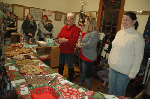 From left are Kay Pylant, Ashley Householder and Heather Allen, cousins who volunteered to serve cookies, hot cocoa and coffee at the Leesburg Christmas Party. (Photo by David Hazledine