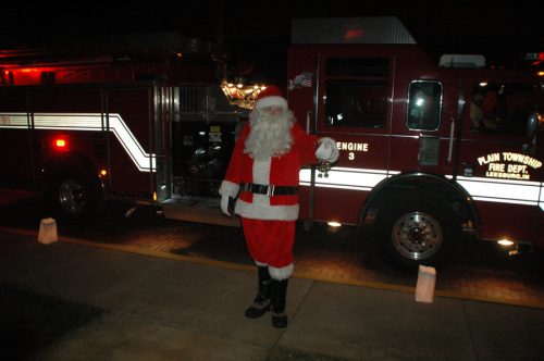 Santa Claus took a spin around downtown Leesburg in a firetruck before stopping at Town Hall to greet families