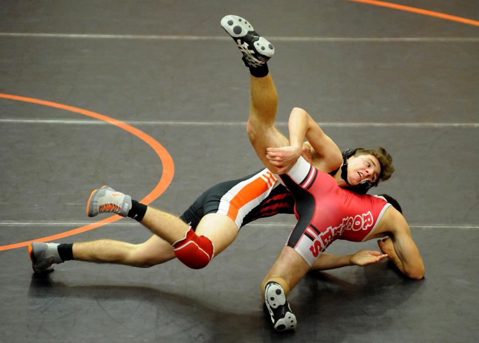 Warsaw's Jose Grimmett takes down Plymouth's Hardy Chapman Tuesday night during the NLC dual between the two clubs at the Tiger Den. (Photos by Mike Deak)