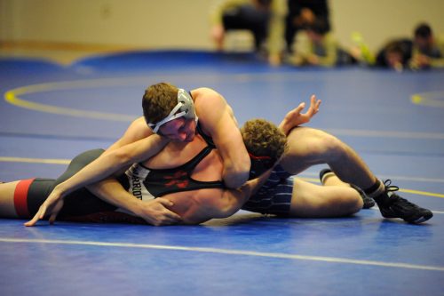 Lee Mullet of Triton works Tyler Sivits of North Miami into an eventual pin.