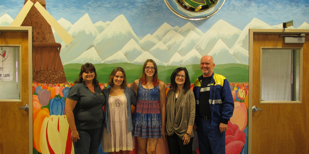 From left, Deanna Cripe, Kaylee Kercher, Michelle Sweers, Kim M. Reiff and Mojmir Mocek stand in front of Sweers and Kercher’s final project.