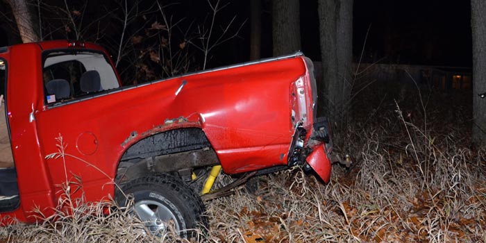 The second vehicle had gone off-road into a patch of trees. 