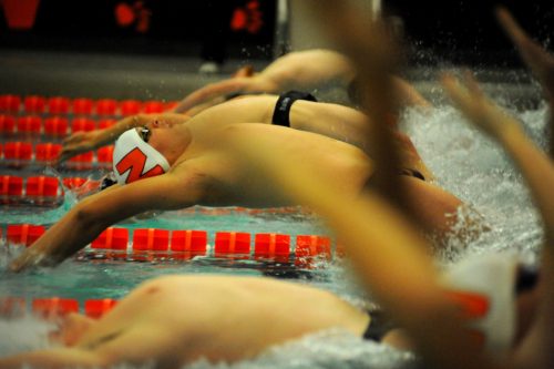 Nick Zogbi leaves the blocks to start the medley relay against Northridge.