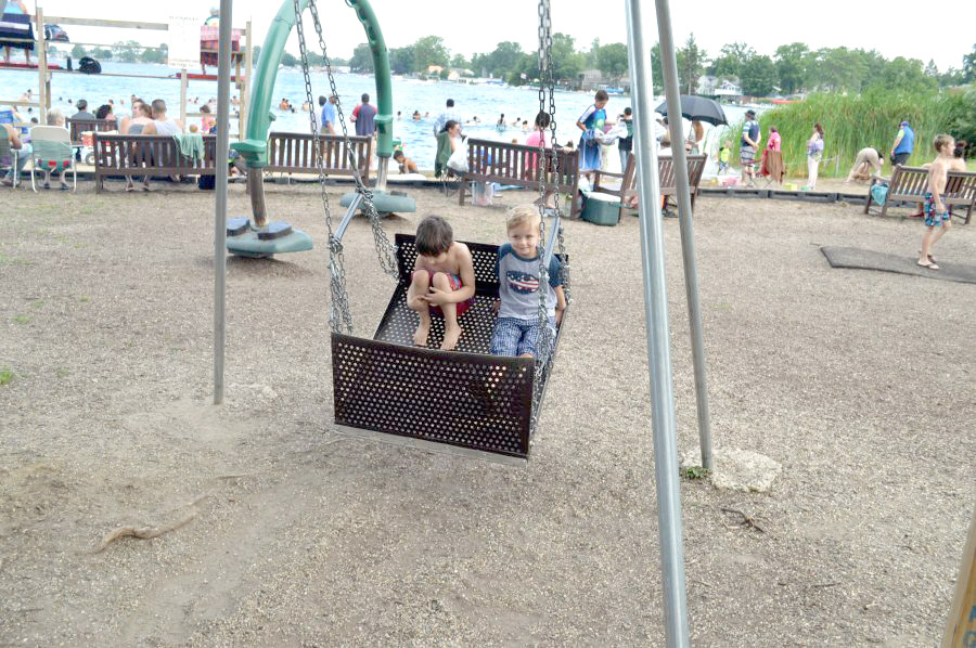 Gavyn James, left, and Noah Hoskin enjoyed one of the swings in the playground area.