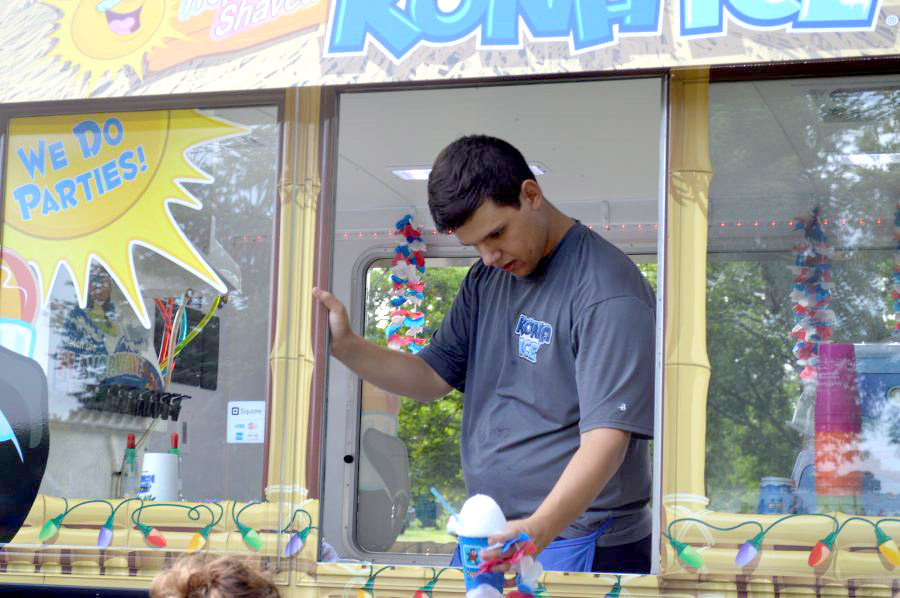 Eddie Martin serves tropical shaved Kona Ice.