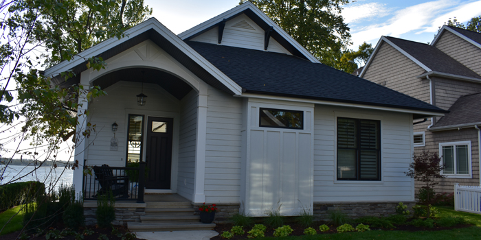 Located on Lake Wawasee, this contemporary cottage was completed by Milestone Construction.